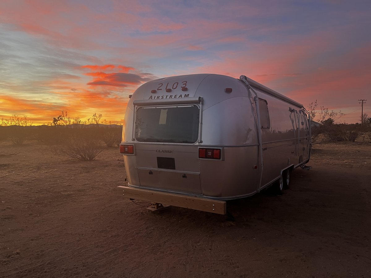 2003 Airstream 30' SO parked in the desert at sunset