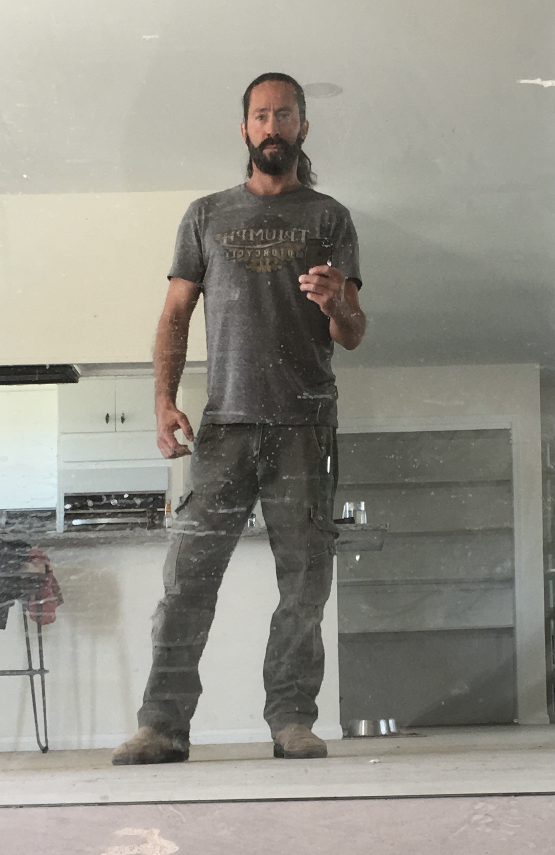Stephen Samojeden standing in a home mid-restoration, Joshua Tree, CA